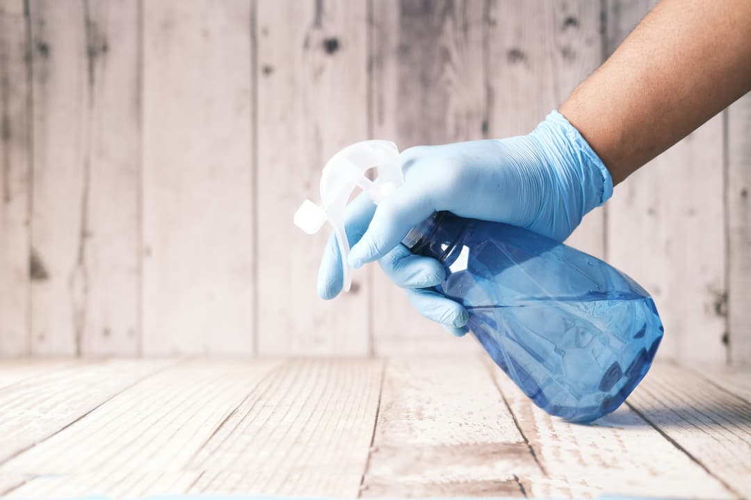 Disinfection specialist sanitizing office surfaces